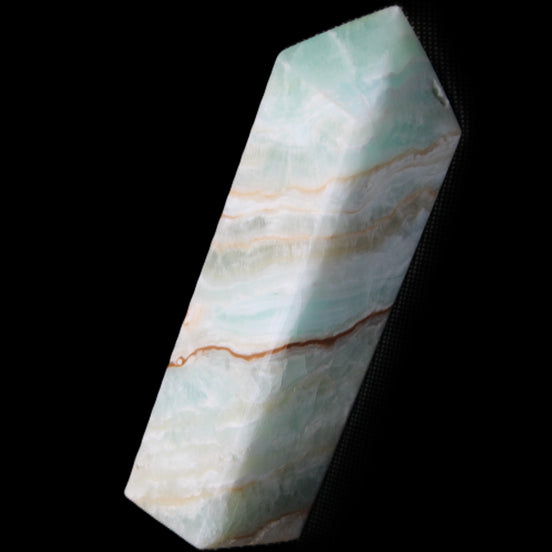 Pistachio Calcite obelisk 120mm 300g in sunlight - Rocks and Things Store