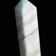 Pistachio Calcite obelisk 120mm 300g in sunlight - Rocks and Things Store
