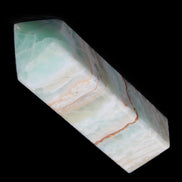 Pistachio Calcite obelisk 120mm 300g in sunlight - Rocks and Things Store