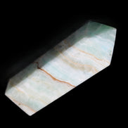 Pistachio Calcite obelisk 120mm 300g in sunlight - Rocks and Things Store