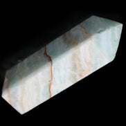 Pistachio Calcite obelisk 120mm 300g in sunlight - Rocks and Things Store