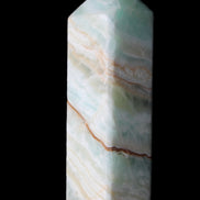 Pistachio Calcite obelisk 120mm 300g in sunlight - Rocks and Things Store