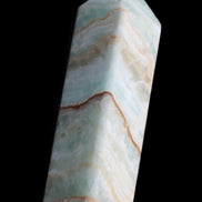 Pistachio Calcite obelisk 120mm 300g in sunlight - Rocks and Things Store