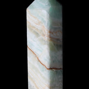 Pistachio Calcite obelisk 120mm 300g in sunlight - Rocks and Things Store