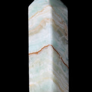 Pistachio Calcite obelisk 120mm 300g in sunlight - Rocks and Things Store