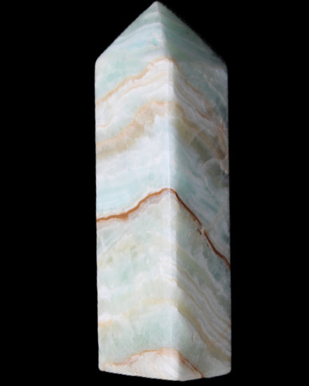 Pistachio Calcite obelisk 120mm 300g in sunlight - Rocks and Things Store