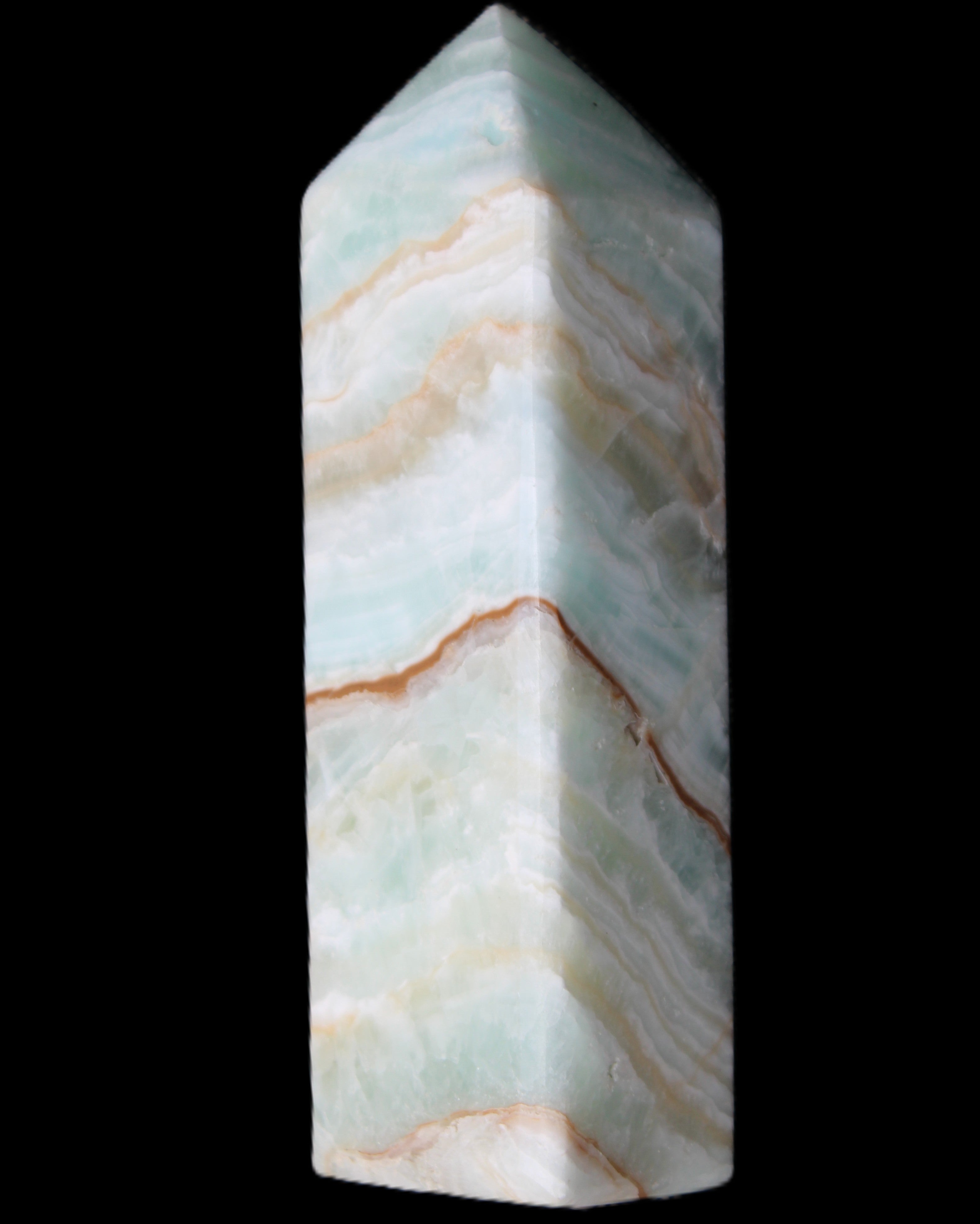 Pistachio Calcite obelisk 120mm 300g in sunlight - Rocks and Things Store