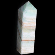 Pistachio Calcite obelisk 120mm 300g in sunlight - Rocks and Things Store