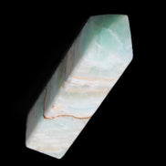 Pistachio Calcite obelisk 120mm 300g in sunlight - Rocks and Things Store