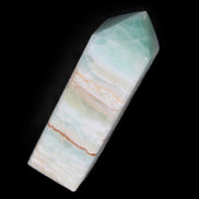 Pistachio Calcite obelisk 120mm 300g in sunlight - Rocks and Things Store