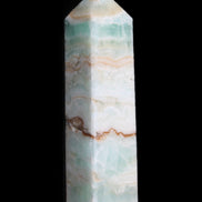 Pistachio Calcite obelisk 118mm 258g in sunlight - Rocks and Things Store