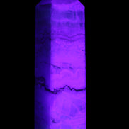 Pistachio Calcite obelisk 118mm 258g in UV light - Rocks and Things Store