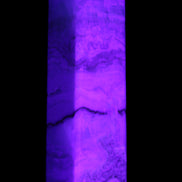 Pistachio Calcite obelisk 118mm 258g in UV light - Rocks and Things Store