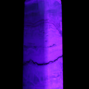 Pistachio Calcite obelisk 118mm 258g in UV light - Rocks and Things Store