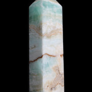 Pistachio Calcite obelisk 118mm 258g in sunlight - Rocks and Things Store