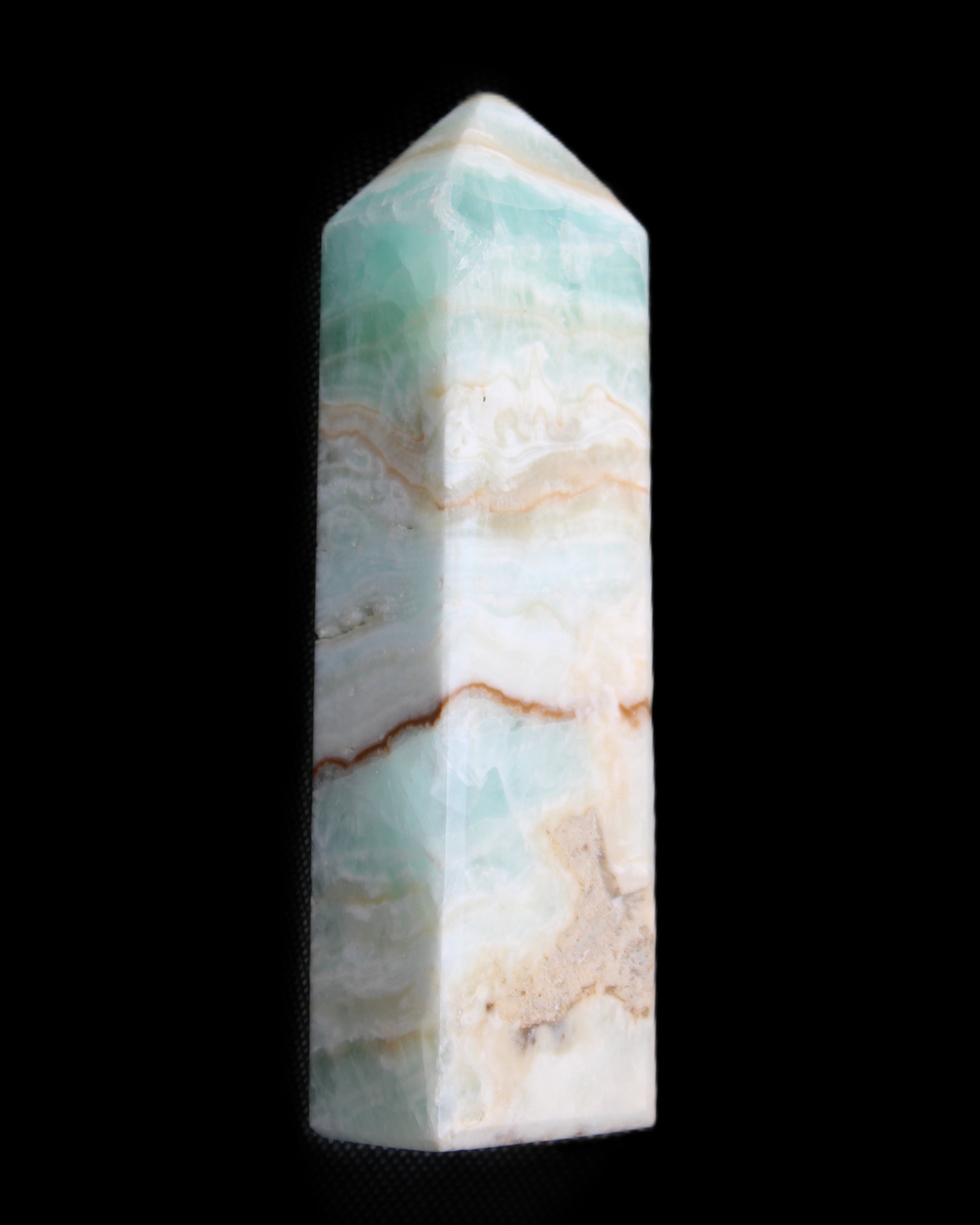 Pistachio Calcite obelisk 118mm 258g in sunlight - Rocks and Things Store