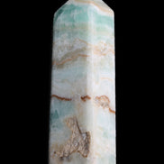 Pistachio Calcite obelisk 118mm 258g in sunlight - Rocks and Things Store