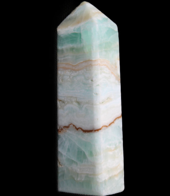 Pistachio Calcite obelisk 118mm 258g in sunlight - Rocks and Things Store