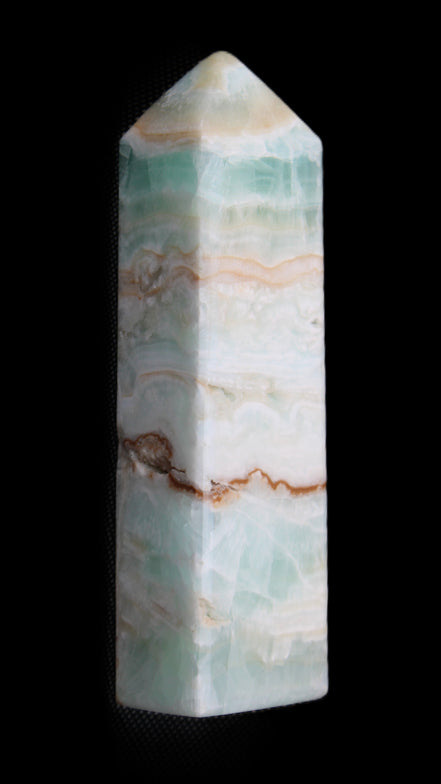 Pistachio Calcite obelisk 118mm 258g in sunlight - Rocks and Things Store