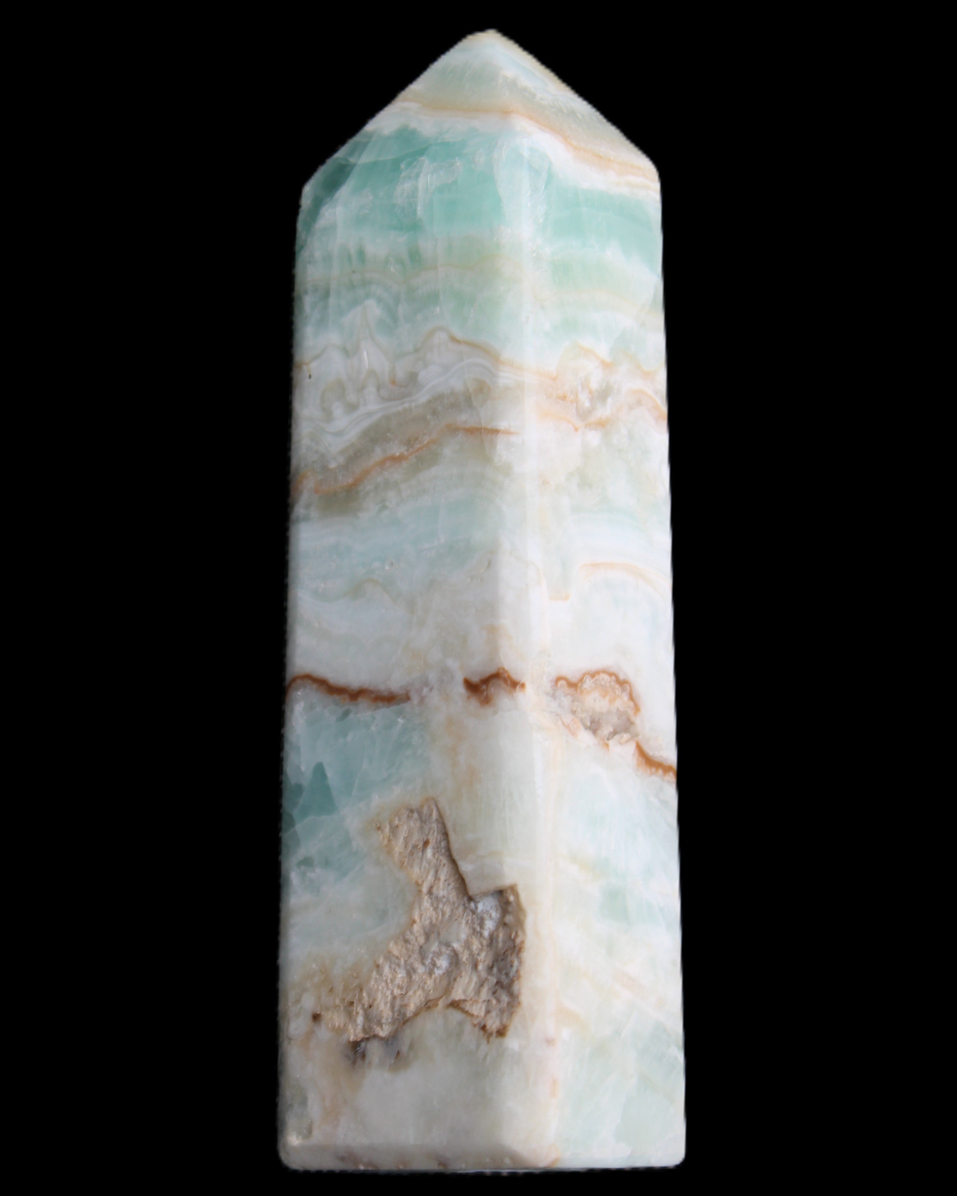 Pistachio Calcite obelisk 118mm 258g in sunlight - Rocks and Things Store
