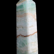 Pistachio Calcite obelisk 118mm 258g in sunlight - Rocks and Things Store