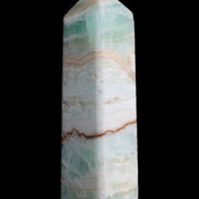 Pistachio Calcite obelisk 118mm 258g in sunlight - Rocks and Things Store