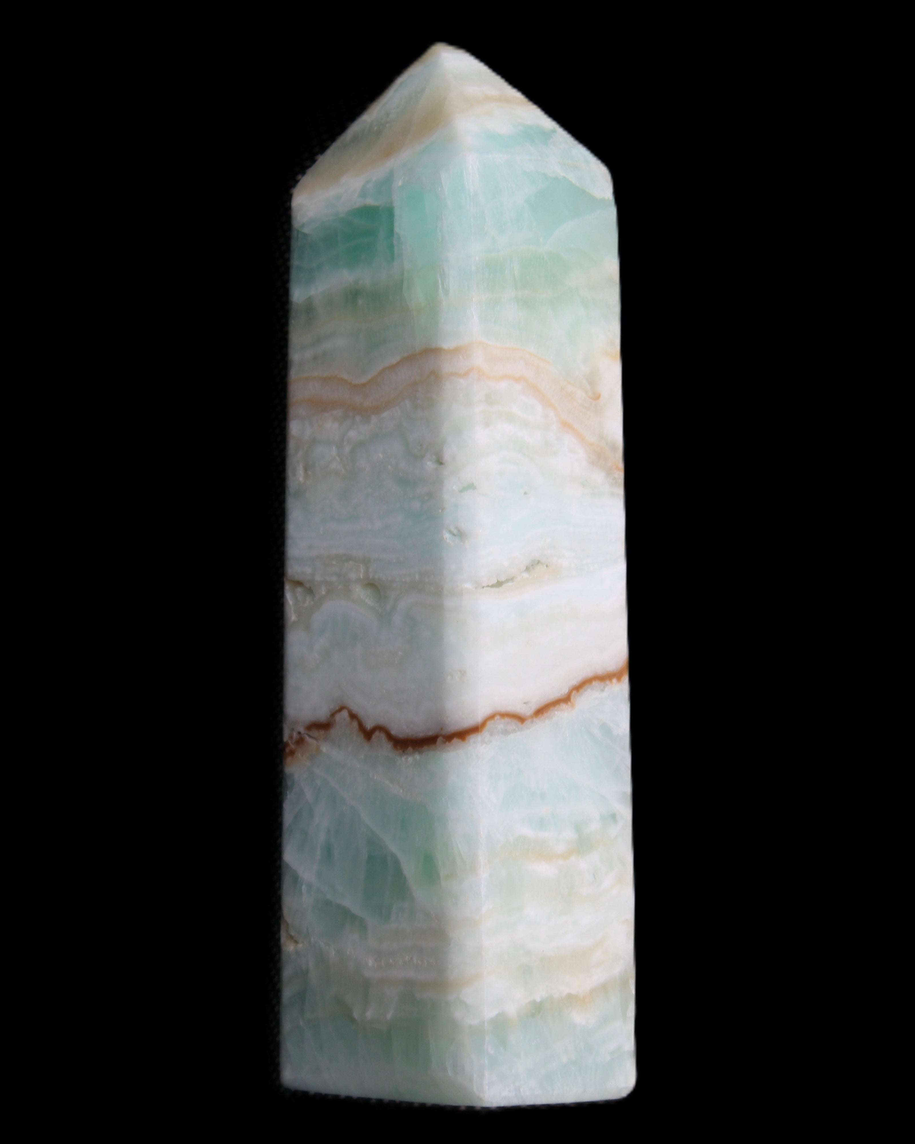 Pistachio Calcite obelisk 118mm 258g in sunlight - Rocks and Things Store