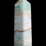 Pistachio Calcite obelisk 118mm 258g in sunlight - Rocks and Things Store