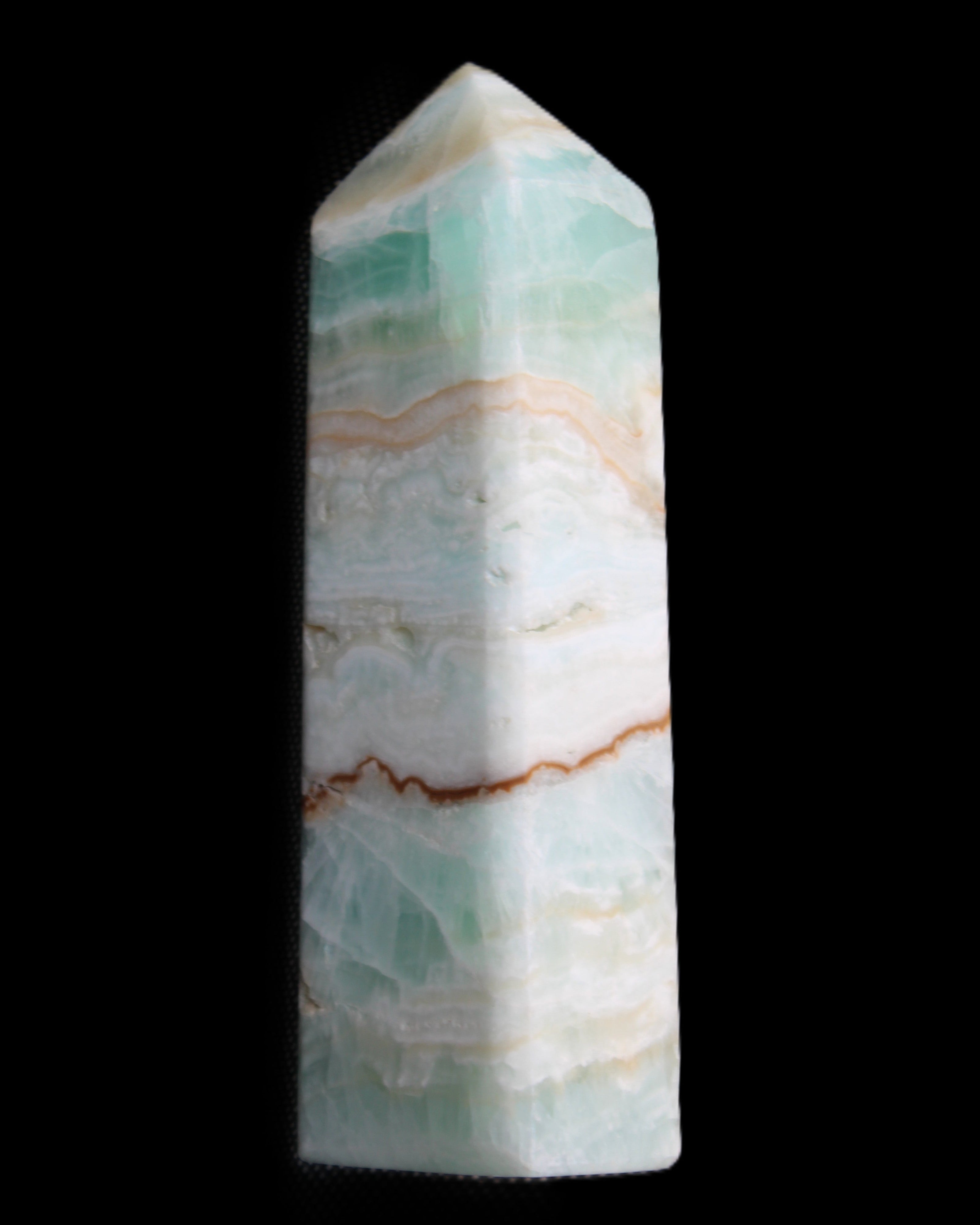Pistachio Calcite obelisk 118mm 258g in sunlight - Rocks and Things Store