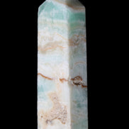 Pistachio Calcite obelisk 118mm 258g in sunlight - Rocks and Things Store