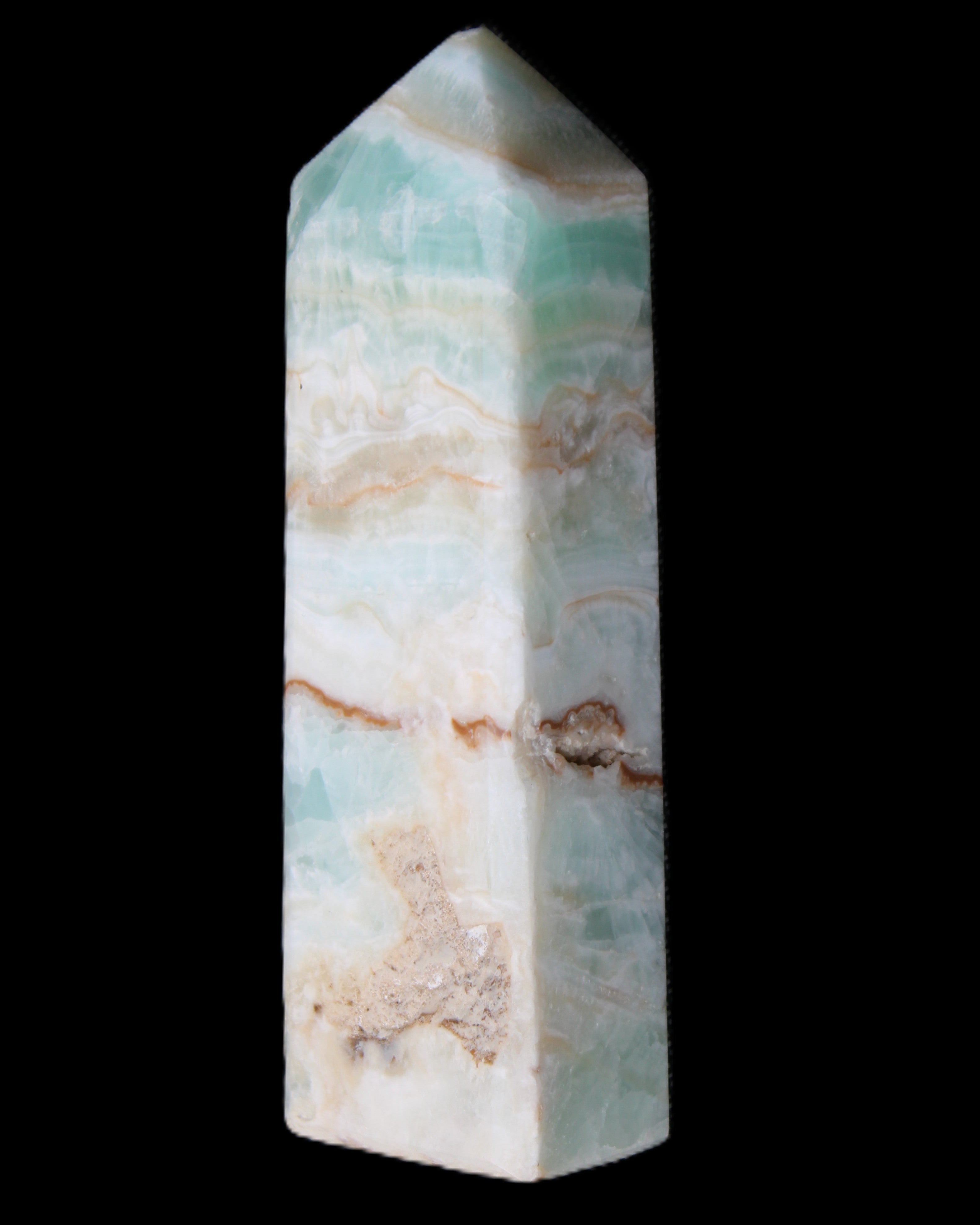 Pistachio Calcite obelisk 118mm 258g in sunlight - Rocks and Things Store