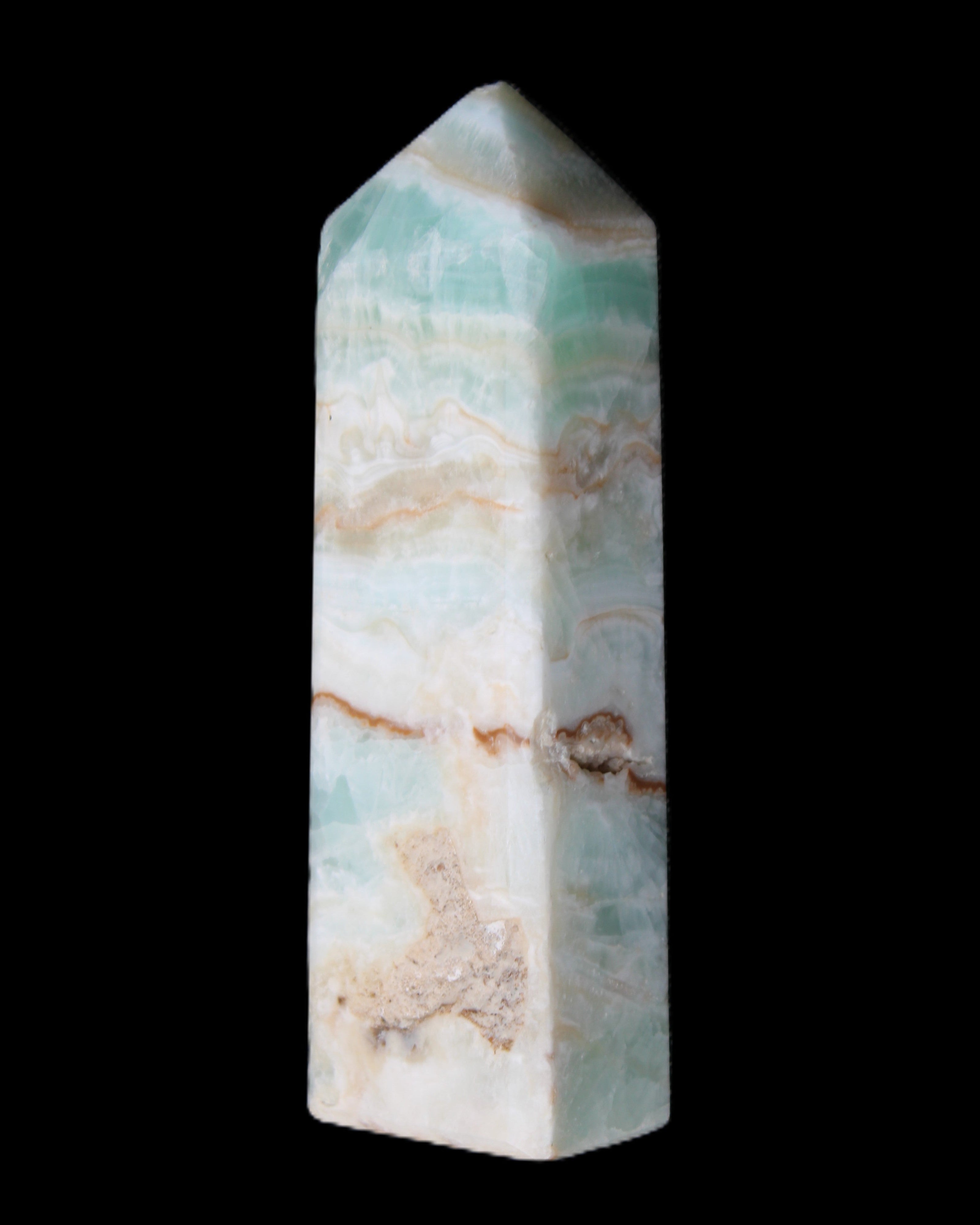 Pistachio Calcite obelisk 118mm 258g in sunlight - Rocks and Things Store