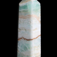 Pistachio Calcite obelisk 118mm 258g in sunlight - Rocks and Things Store