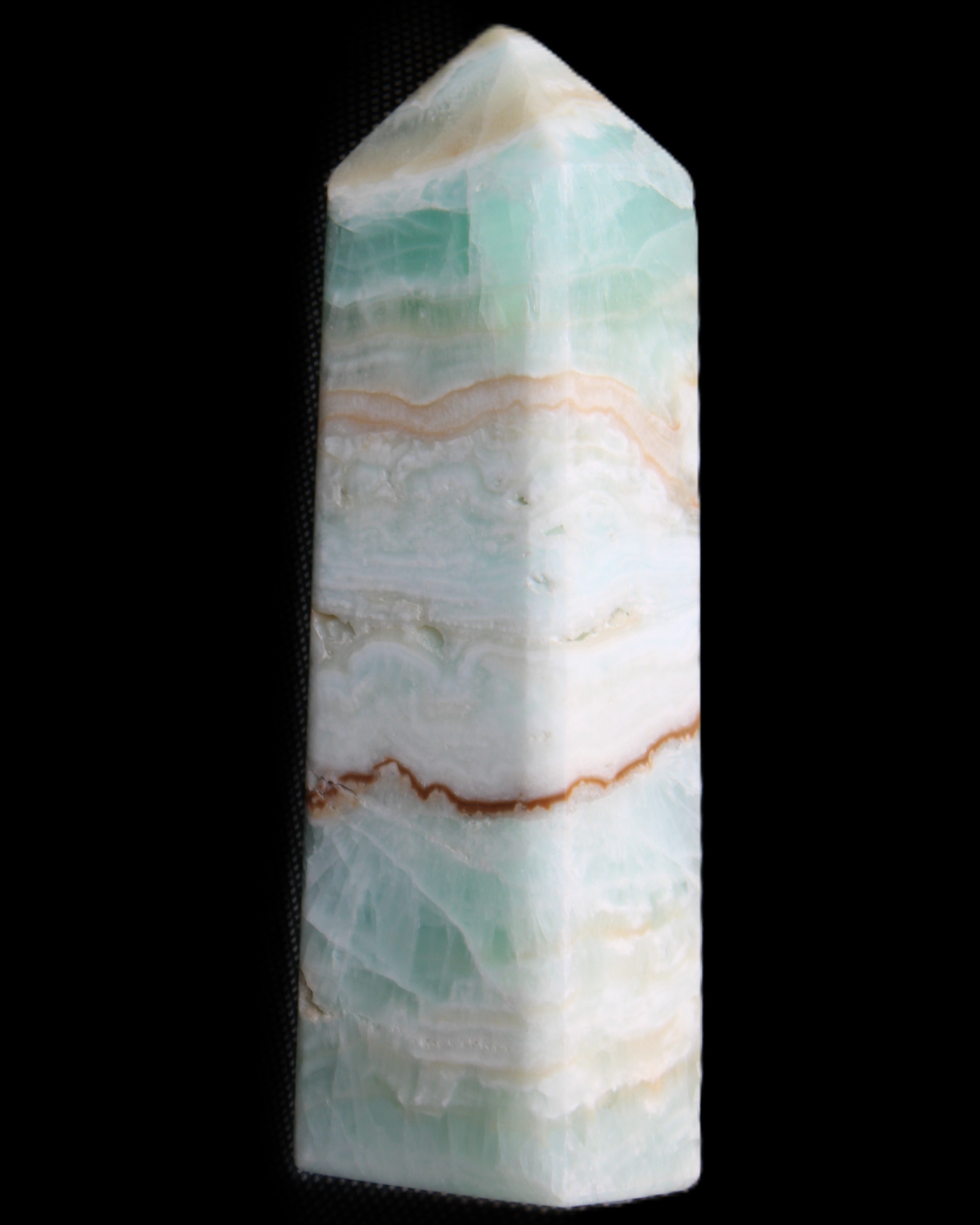 Pistachio Calcite obelisk 118mm 258g in sunlight - Rocks and Things Store