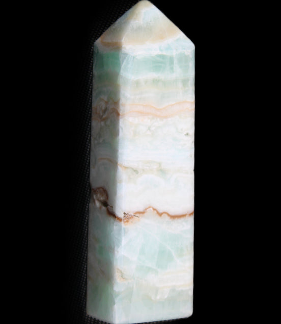 Pistachio Calcite obelisk 118mm 258g in sunlight - Rocks and Things Store