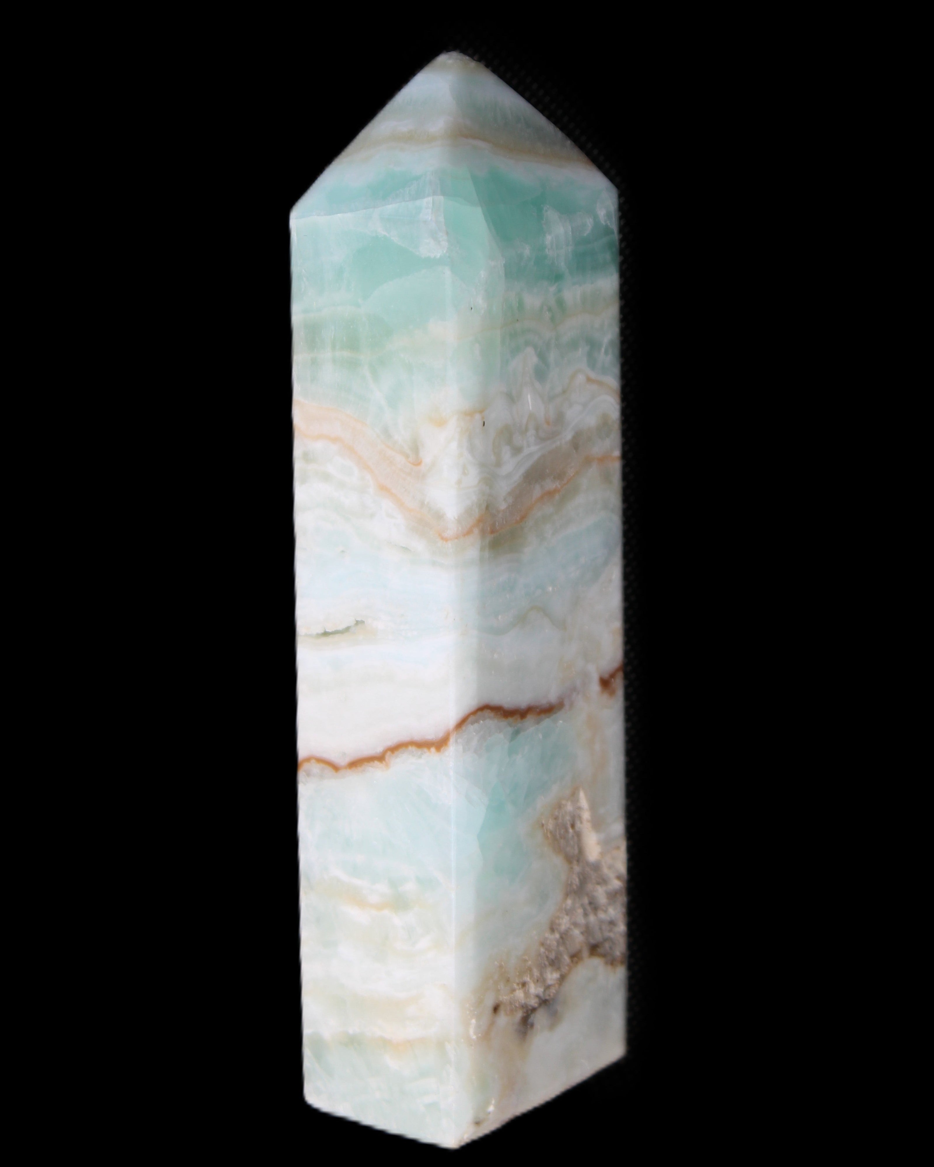 Pistachio Calcite obelisk 118mm 258g in sunlight - Rocks and Things Store