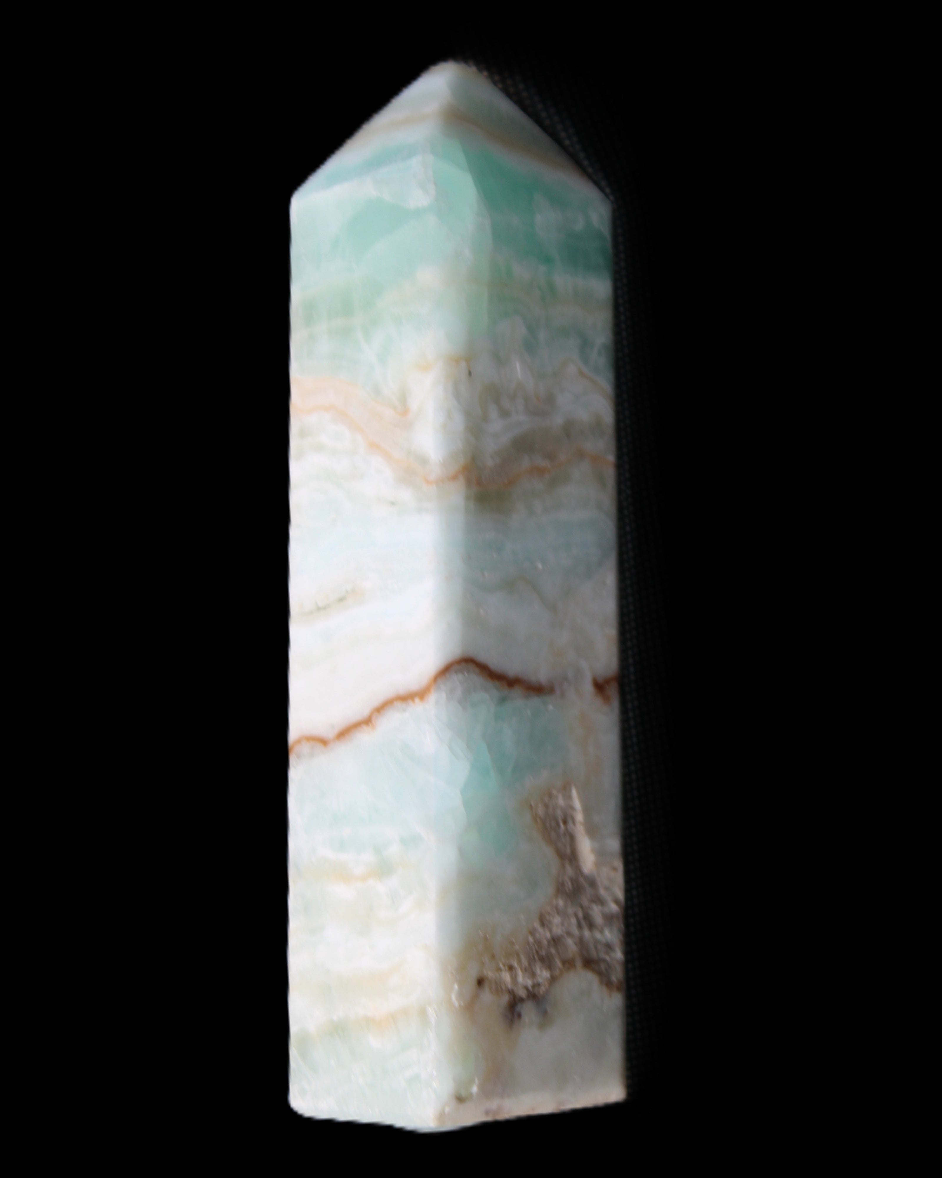 Pistachio Calcite obelisk 118mm 258g in sunlight - Rocks and Things Store