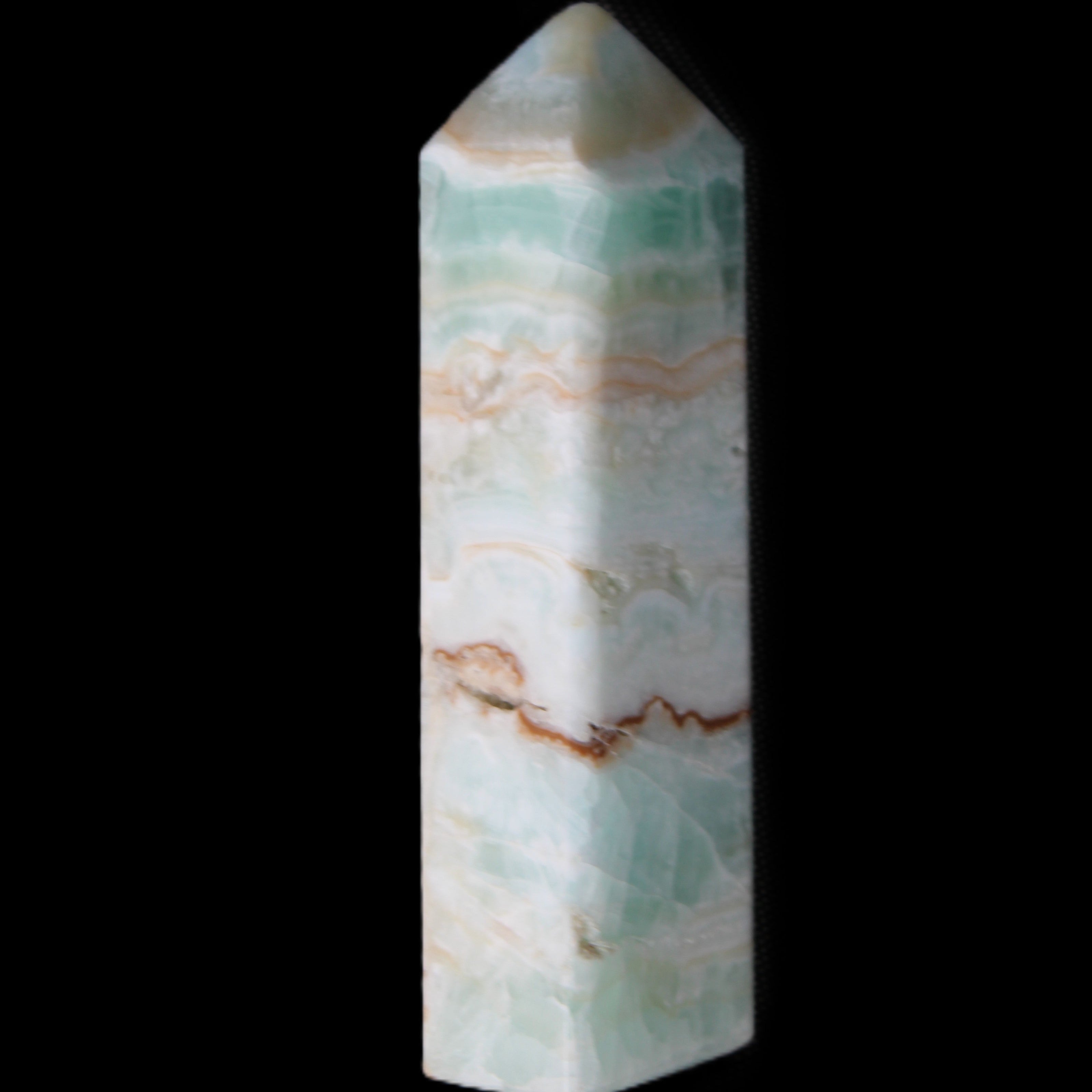 Pistachio Calcite obelisk 118mm 258g in sunlight - Rocks and Things Store