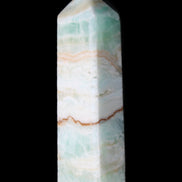 Pistachio Calcite obelisk 118mm 258g in sunlight - Rocks and Things Store