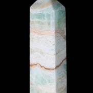 Pistachio Calcite obelisk 118mm 258g in sunlight - Rocks and Things Store
