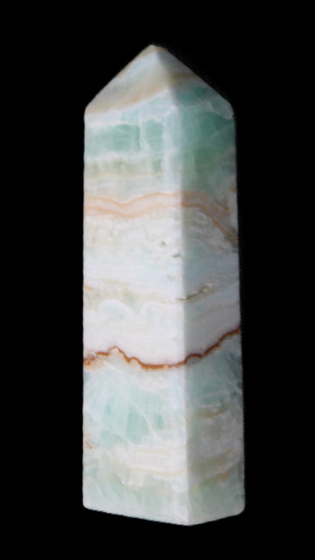 Pistachio Calcite obelisk 118mm 258g in sunlight - Rocks and Things Store