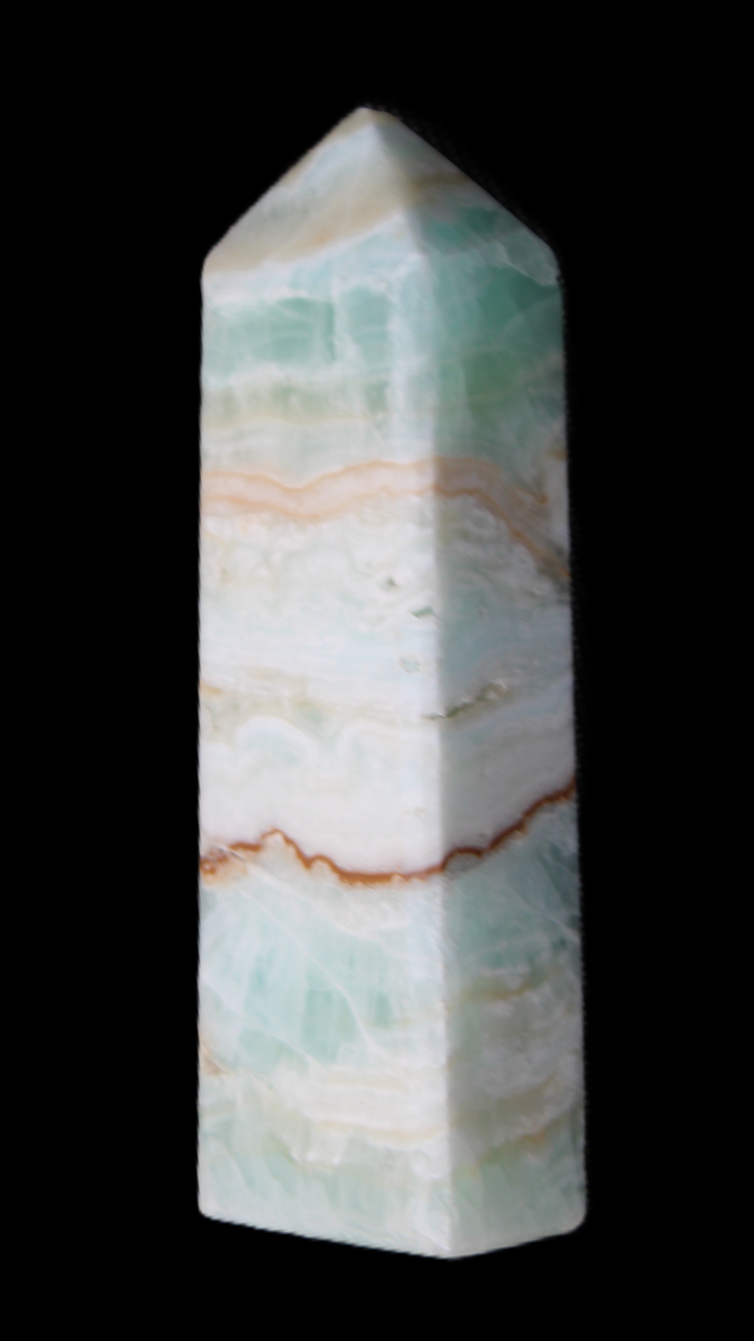 Pistachio Calcite obelisk 118mm 258g in sunlight - Rocks and Things Store