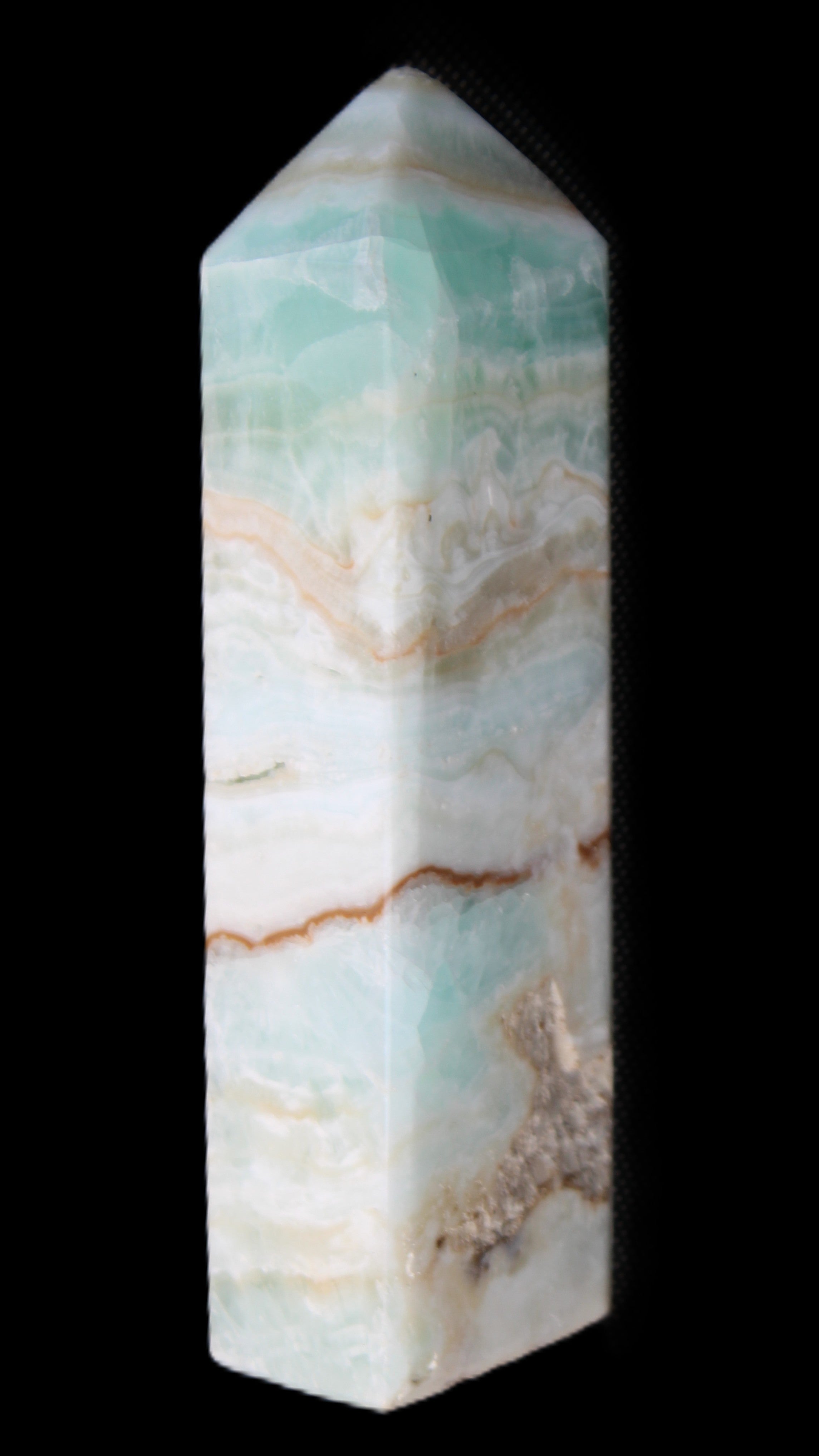 Pistachio Calcite obelisk 118mm 258g in sunlight - Rocks and Things Store