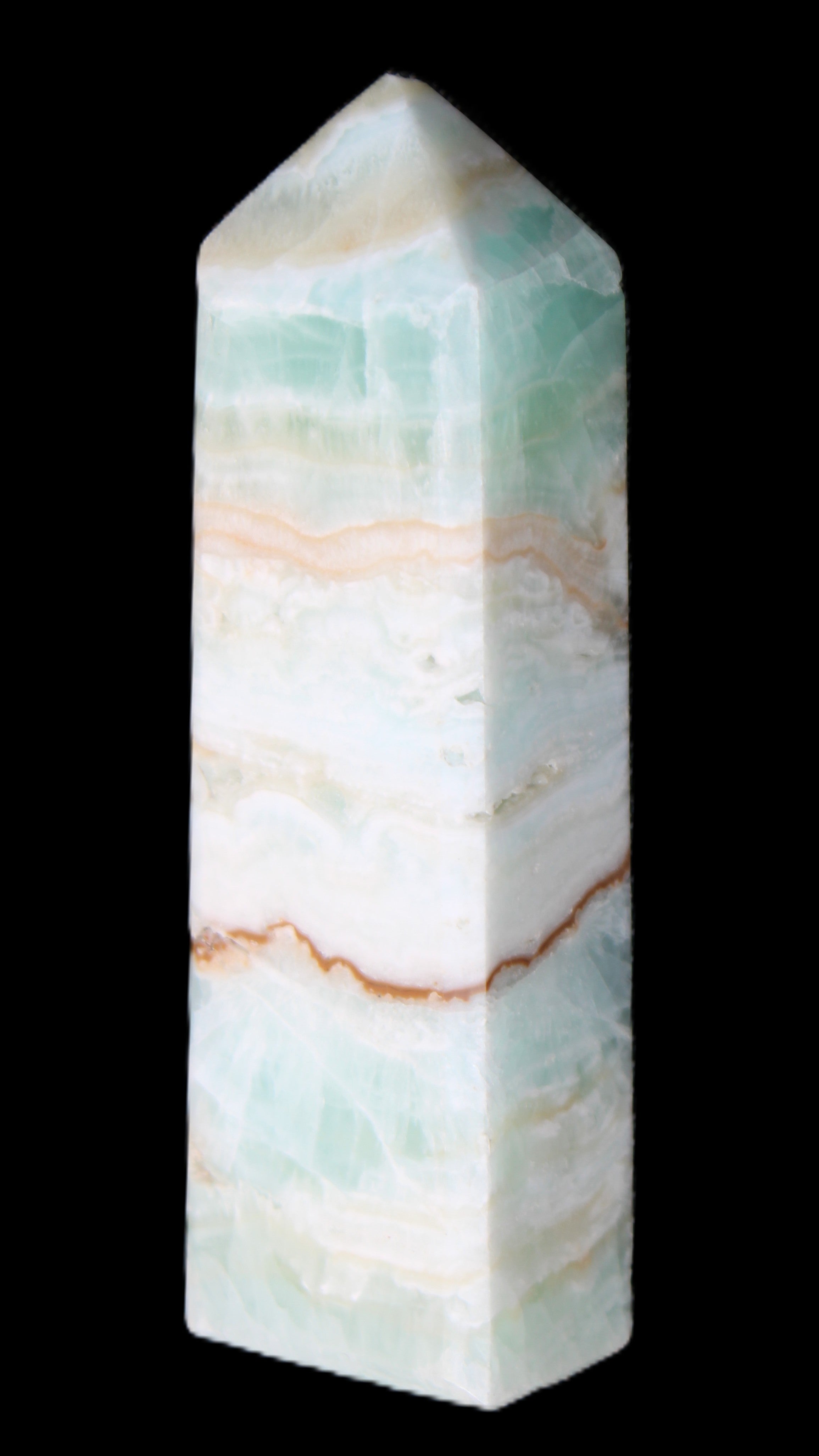 Pistachio Calcite obelisk 118mm 258g in sunlight - Rocks and Things Store