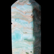 Caribbean Calcite Blue Aragonite obelisk 75*26mm 125g in sunlight - Rocks and Things Store
