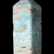 Caribbean Calcite Blue Aragonite obelisk 75*26mm 125g in sunlight - Rocks and Things Store