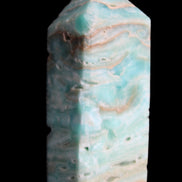 Caribbean Calcite Blue Aragonite obelisk 75*26mm 125g in sunlight - Rocks and Things Store