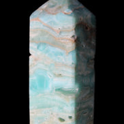 Caribbean Calcite Blue Aragonite obelisk 75*26mm 125g in sunlight - Rocks and Things Store