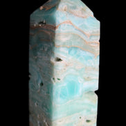 Caribbean Calcite Blue Aragonite obelisk 75*26mm 125g in sunlight - Rocks and Things Store