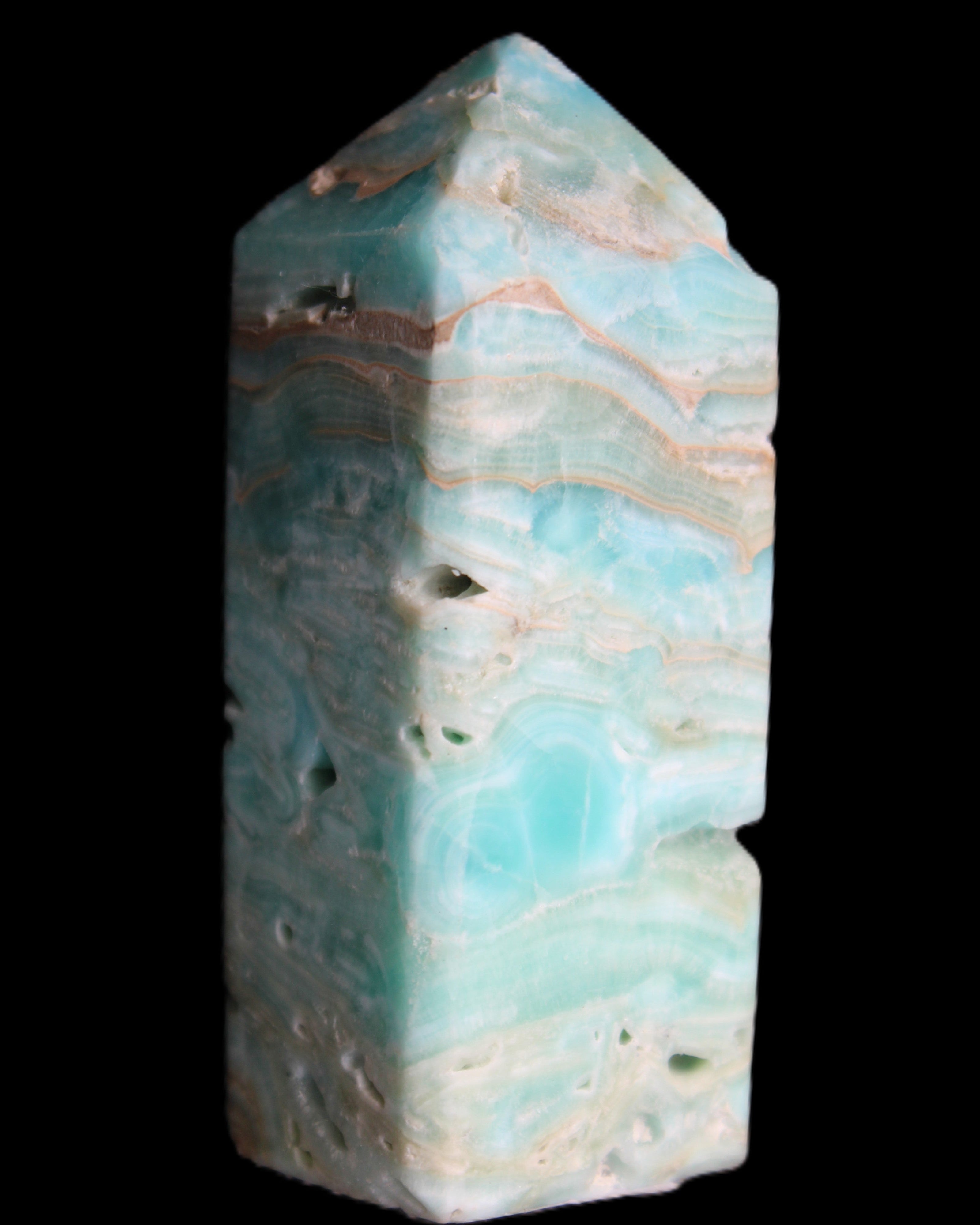 Caribbean Calcite Blue Aragonite obelisk 75*26mm 125g in sunlight - Rocks and Things Store